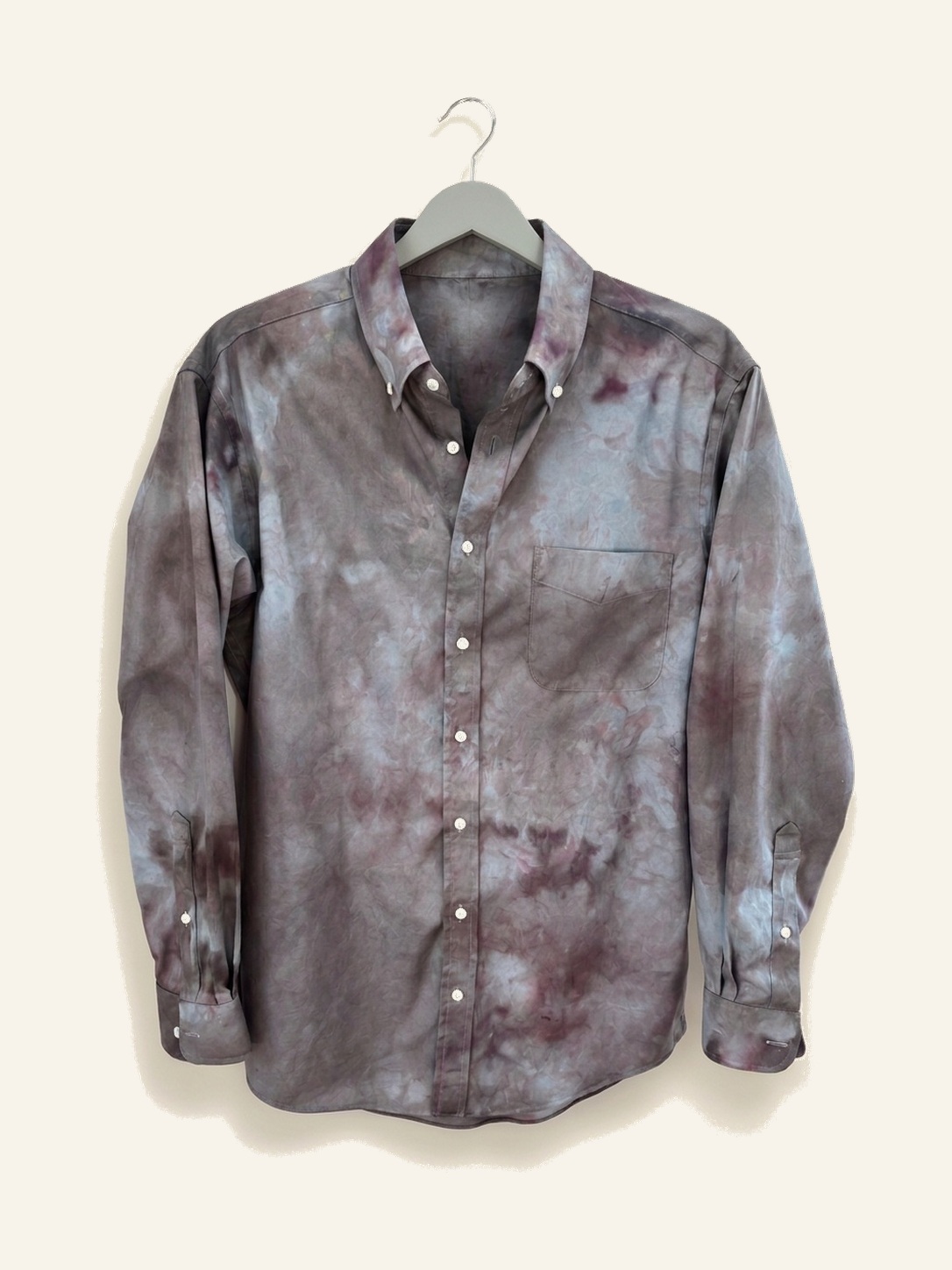 Hand ice-dyed cotton shirt in grey, violet and wine on a pale grey hanger