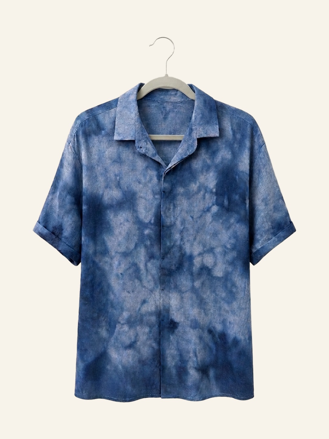 Hand ice-dyed bamboo and linen blue shirt on a wooden hanger